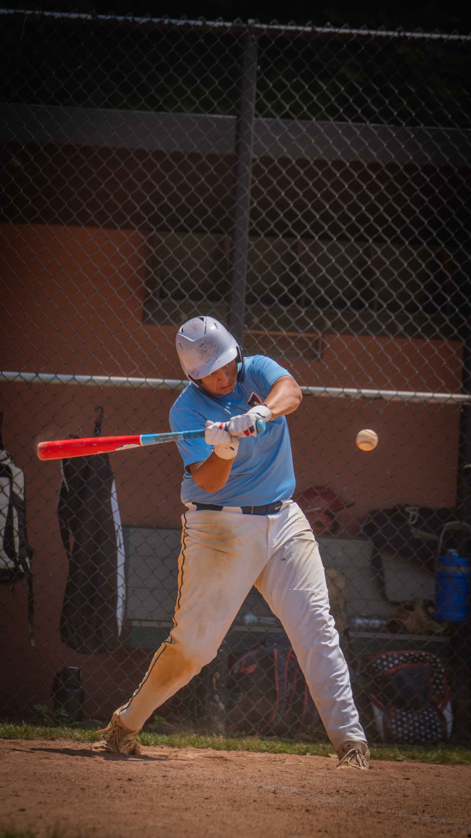 Baseball player making contact with a pitch